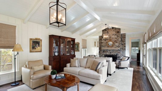 living room with vaulted white ceiling